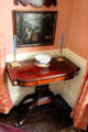 Card table by John Seymour of Boston with punchbowl & Italian painting in parlor at Nichols House Museum. Boston, MA.