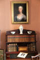 Portrait over bookshelves in parlor at Nichols House Museum. Boston, MA.