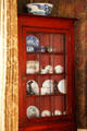 Dining room cupboard with collection of china at Nichols House Museum. Boston, MA.