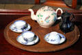 Chinese porcelain cups, saucers & teapot , earthenware English cream pot at Concord Museum. Concord, MA.