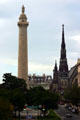 Washington Monument beside spire of Mount Vernon Place United Methodist Church. Baltimore, MD.