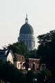 State Capitol dome over village houses. Augusta, ME.