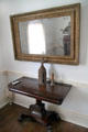 Side table & framed mirror at General Daniel Bissell House. St. Louis, MO.