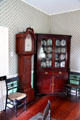 Dining room tall clock & corner cabinet at General Daniel Bissell House. St. Louis, MO.