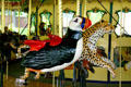 Puffin & cheetah riding characters on carousel at St. Louis Zoo. St Louis, MO.