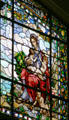 Charity panel with mother holding children on Missouri values stained glass window at Missouri State Capitol. Jefferson City, MO.