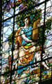 Law panel with woman holding books plus light & truth tablet on Missouri values stained glass window at Missouri State Capitol. Jefferson City, MO.