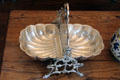 Silver plated biscuit holder with fold down serving halves at Vaile Mansion. Independence, MO