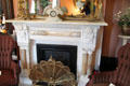 Fireplace with fan-shaped fire screen at Vaile Mansion. Independence, MO.
