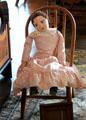 Doll in toy chair at Beauvoir. Biloxi, MS.