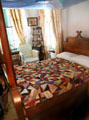 Varina Davis bedroom with crazy quilt at Beauvoir. Biloxi, MS.