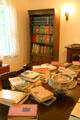 Books stacked in dining room of Eudora Welty House. Jackson, MS.