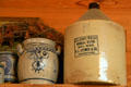 Stoneware jug from Way, MS & blue painted salt glaze jar at Mississippi Agriculture & Forestry Museum. Jackson, MS.