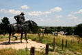 Statue of cowboy looks over Ogallala from Boot Hill Cemetery. Ogallala, NE.