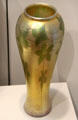 Iridescent gold Favrile glass vase by Louis Comfort Tiffany of New York City at Currier Museum of Art. Manchester, NH.