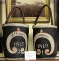 Leather fire buckets marked J. Guppey at Woodman Museum. Dover, NH.