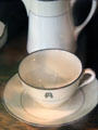 Stickley family porcelain cup & saucer with Als Ik Kan crest at Stickley Museum at Craftsman Farms. Morris Plains, NJ.