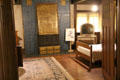 Bedroom with blue surround fireplace at Stickley Museum at Craftsman Farms. Morris Plains, NJ.