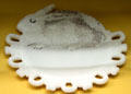 Pressed milk glass rabbit plaque by Westmoreland Co. of Grapeville, PA at Museum of American Glass. Milville, NJ.