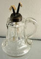 Pressed glass harp or lyre pattern whale oil lamp by unknown at Museum of American Glass. Milville, NJ.