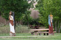 Park along Santa Fe River with carved statues. Santa Fe, NM.