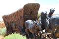 Mules stumble pulling wagon in Journey's End Santa Fe Trail Monument. Santa Fe, NM.