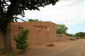 Adobe outer defensive walls of Casa San Ysidro complex. Corrales, NM.
