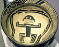 Mimbres classic black-on-white pottery bowl with man at Maxwell Museum of Anthropology. Albuquerque, NM.
