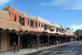 Heritage Territorial-style buildings on west side of Taos Plaza. Taos, NM.