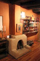 Taos fireplace & library at Blumenschein Home & Museum. Taos, NM.