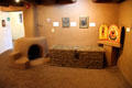 Gallery with fireplace, chest or icons at Millicent Rogers Museum. Taos, NM.