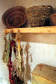 Baskets & drying herbs in kitchen at Hacienda de los Martinez. Taos, NM.