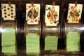 Detail of Draw Poker showing early slot machines flipped cards on wheel by Fey at Nevada State Museum. Carson City, NV.