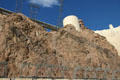 Power lines climb cliff to carry power toward Las Vegas. Las Vegas, NV.