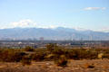 Skyline of Las Vegas against mountain backdrop from southeast of city. Las Vegas, NV.