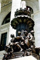 Lamp stands with statues of students on steps of New York State Education Department. Albany, NY.
