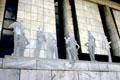 Cutout people sculpture set off by marble of Legislative Office Building. Albany, NY.