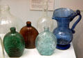 Lancaster Glass Works flasks & Lilly-pad blue glass pitcher at Buffalo History Museum. Buffalo, NY.