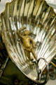 Detail of cherub in shell on Deluge parade carriage at FASNY Museum of Firefighting. Hudson, NY.