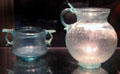 Early Roman cast glass cup with two handles & pitcher at Corning Museum of Glass. Corning, NY.