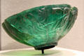Islamic green glass bowl with figures at Corning Museum of Glass. Corning, NY.