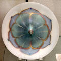 Decorated Aurene glass plate by Steuben Glass at Corning Museum of Glass. Corning, NY.