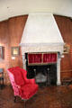 Library hearth & English wing armchair at Hyde House. Glens Falls, NY.