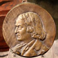 Elbert Hubbard bronze medallion at Roycroft Campus Powerhouse. East Aurora, NY.