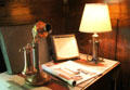 Roycroft hammered copper candlestick telephone & table lamp at Elbert Hubbard Roycroft Museum. East Aurora, NY.
