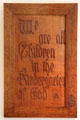 "We are all Children in the Kindergarten of God" wood carved slogan by Roycroft at Elbert Hubbard Roycroft Museum. East Aurora, NY.