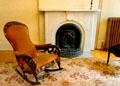 Marble fireplace & rocking chair at Susan B. Anthony House. Rochester, NY.