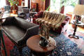 Billiard room with sofas, raccoon fur throw & telephone at Eastman House. Rochester, NY.