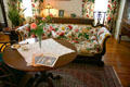 Floral pattern sofa & tea table in Mrs. Eastman's bedroom at Eastman House. Rochester, NY.
