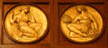 Relief roundels showing Polyhymnia & Thalia muses on Rush Rhees Library facade at University of Rochester. Rochester, NY.